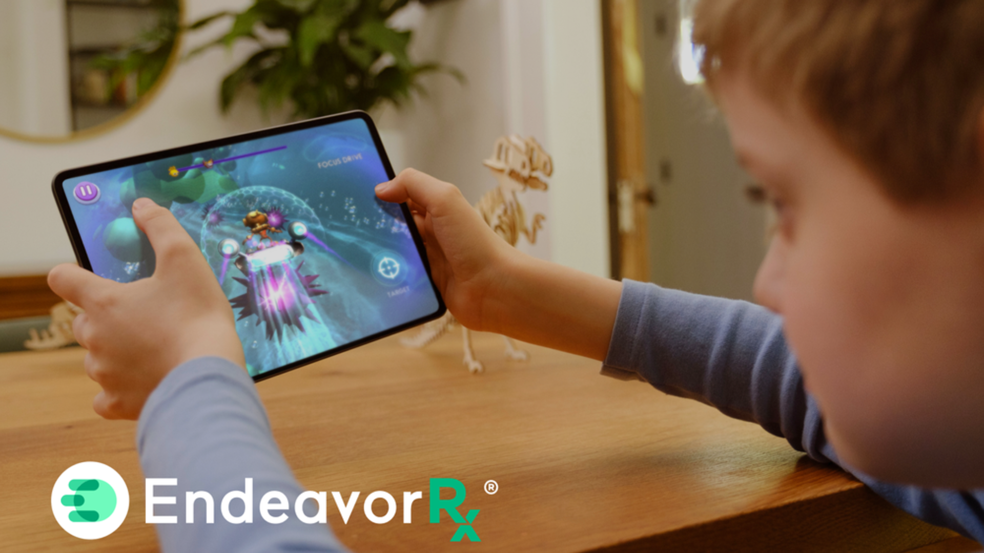 Enfant utilisant un jeu thérapeutique EndeavorRx sur tablette, innovation medtech en santé pédiatrique