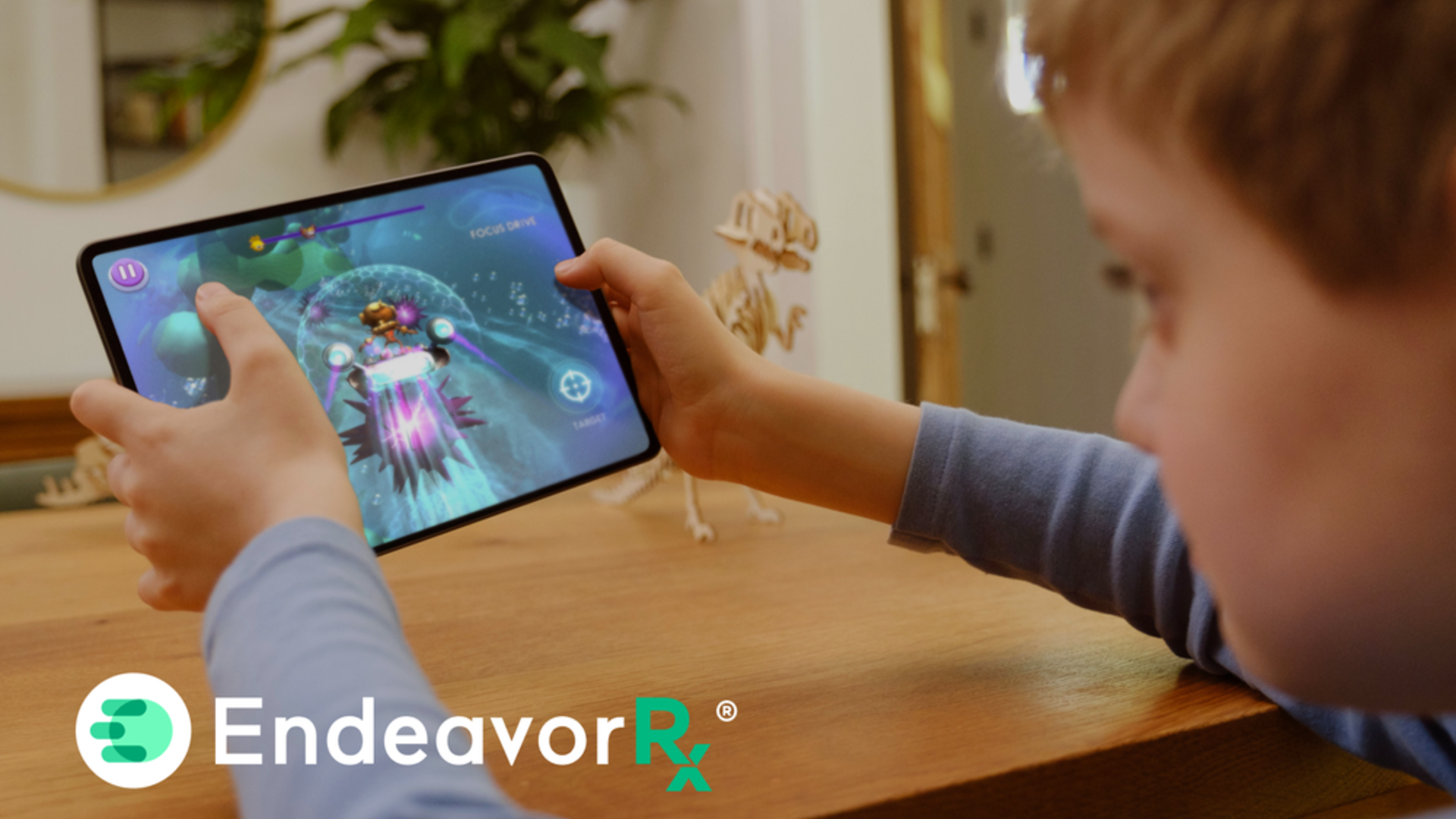 Child using EndeavorRx therapeutic game on tablet, one of pediatric medical devices in pediatric health